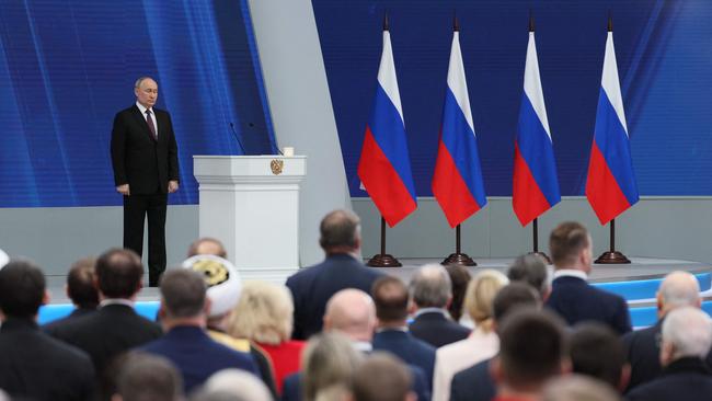 In this pool photograph distributed by Russian state agency Sputnik, Russia's President Vladimir Putin delivers his annual state of the nation address at the Gostiny Dvor conference centre. Picture: AFP