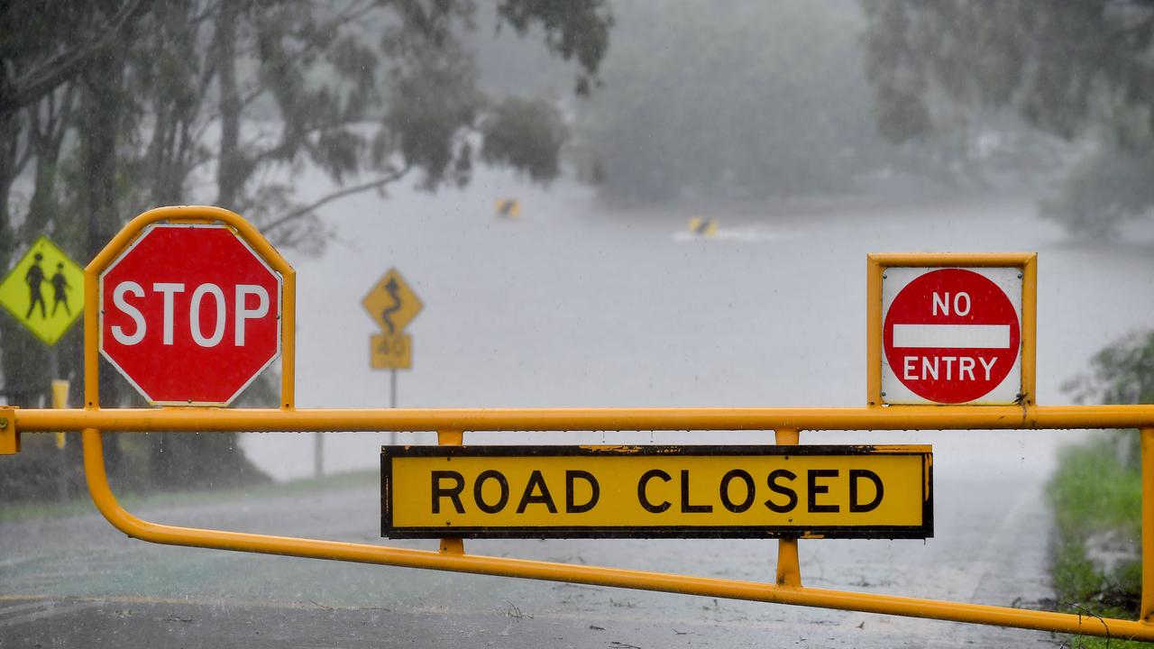 Torrential rain and major flooding around Brisbane and a road closed at Young's crossing road in Bray Park. Picture: NCA NewsWire / John Gass