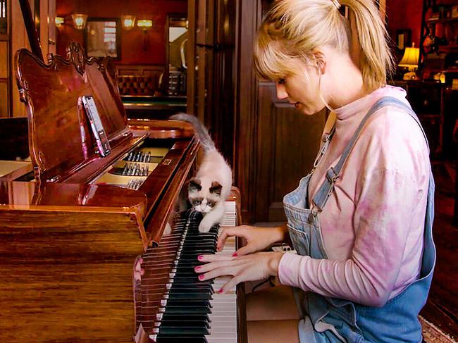 Taylor plays the guitar with her cat in a scene from her 2020 documentary, “Miss Americana”. The feature gave fans a behind-the-scenes look at Swift's story, as told in her own words. Picture: Netflix