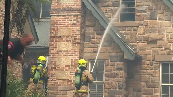 Firefighters battle the blaze at a home in Northmead today. Picture: TNV