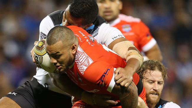 Addin Fonua-Blake shows his determination to get through the Fijian defence.