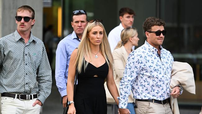 The family of Michelle Wolff - husband Gavin (centre), son Kobi (left), daughters Jacinda Collins (black dress) and Kasey leave the Supreme Court in Brisbane. Picture: NCA NewsWire