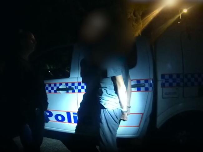 Troy Andrew Burns, 52, is arrested by police at the scene of an incident in Varsity Lakes during which a 15-year-old boy was stabbed. Picture: QPS