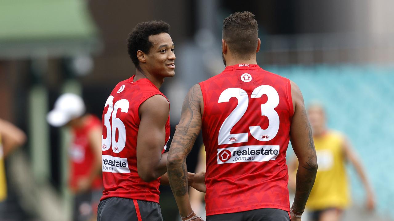 Joel Amartey with retired Sydney and Hawthorn legend Lance Franklin (right) at Swans training last season. Picture: Phil Hillyard