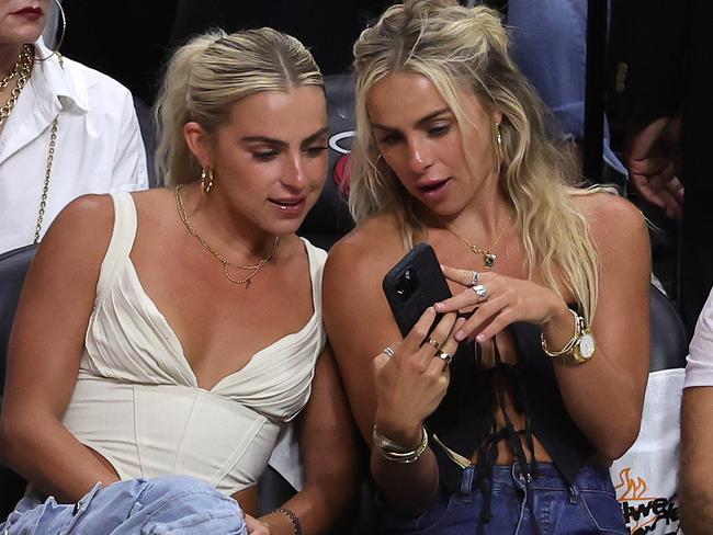 MIAMI, FLORIDA - JUNE 09: Haley and Hanna Cavinder are seen in attendance during Game Four of the 2023 NBA Finals between the Denver Nuggets and the Miami Heat at Kaseya Center on June 09, 2023 in Miami, Florida. NOTE TO USER: User expressly acknowledges and agrees that, by downloading and or using this photograph, User is consenting to the terms and conditions of the Getty Images License Agreement. (Photo by Megan Briggs/Getty Images)