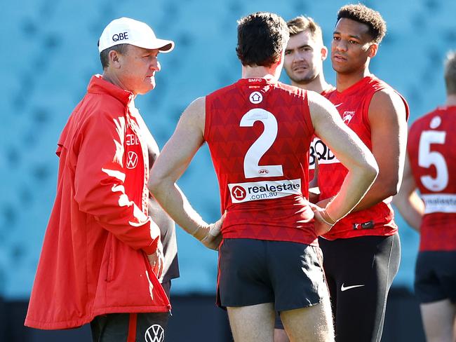 Longmire talks with McLean, Amartey and McDonald at training on Tuesday. Picture: Phil Hillyard