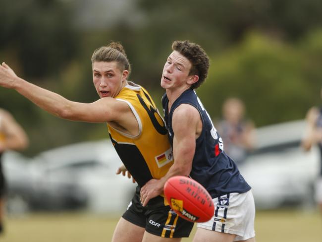 Daniel Hughes playing for Frankston YCW and Edi-Asp’s Nick Carlon. Picture: Valeriu Campan