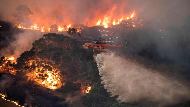 There were 429 smoke-related deaths and 3230 hospital admissions across Australia in the 2019-20 bushfire season. Pictured is a bushfire in Victoria’s East Gippsland on December 31. Picture: AFP / Victorian Government