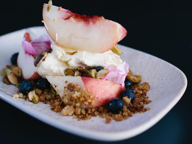 Pheast’s rose scented whipped cheese cake with peaches and pistachios. Picture: Tracy Jack