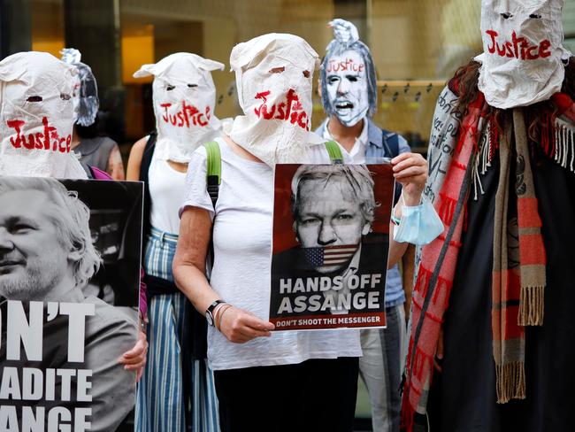 Demonstrators protest outside the London court hearing Assange’s extradition case. Picture: AFP