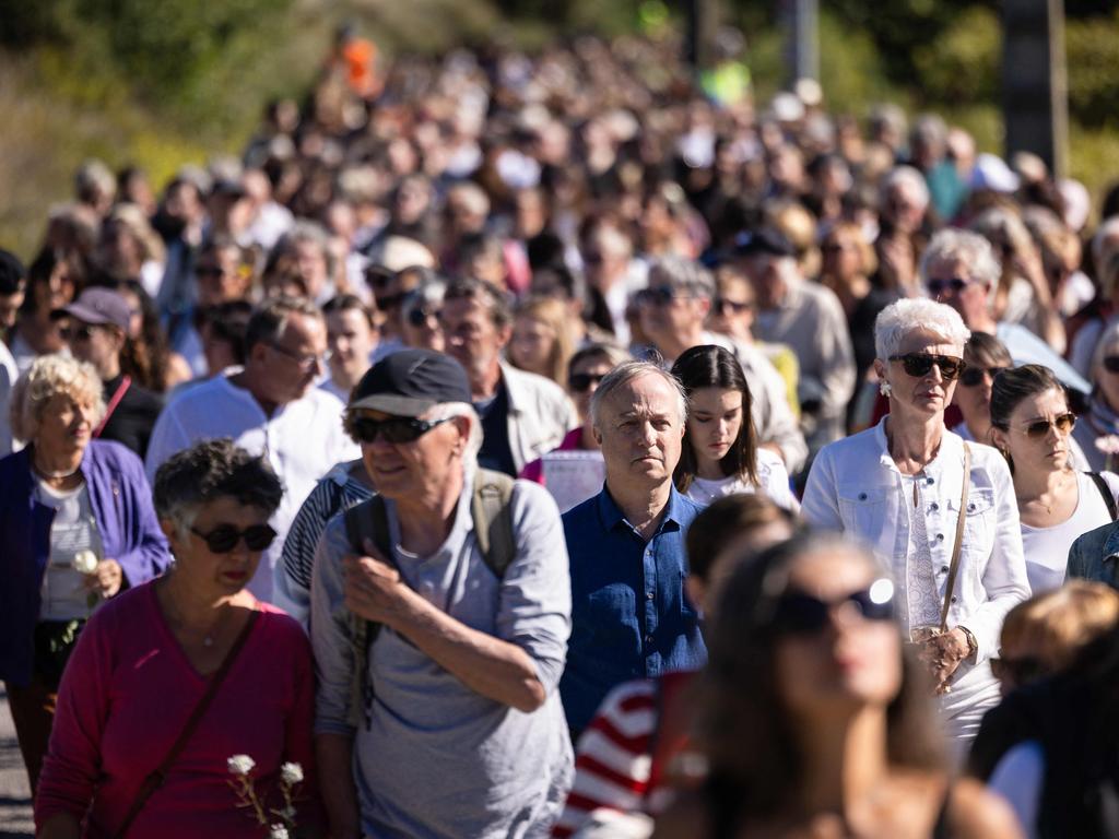 Ms Pelicot’s willingness to highlight her suffering has won widespread praise and made her a feminist icon in France. People are seen taking part in a march in Ms Pelicot’s village in southeastern France in solidarity. Picture: Clement Mahoudeau/AFP