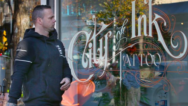 Jake King at the tattoo parlour after the shooting. Picture: David Crosling