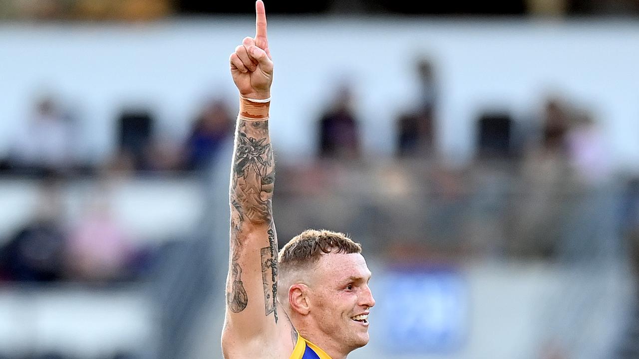 Mitch Robinson celebrates after kicking a goal for the Lions against the Giants. Picture: Bradley Kanaris/Getty Images