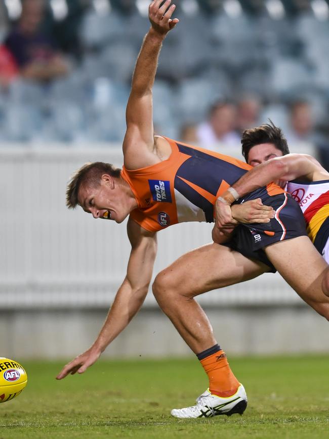 Chayce Jones wraps up the Giants’ Adam Tomlinson during their JLT Series clash. Picture:AAP Image/Lukas Coch