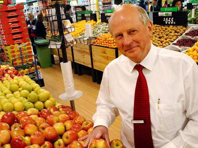 Woolworths CEO Roger Corbett stands by fruit display at the Woolworths supermarket in Sydney.