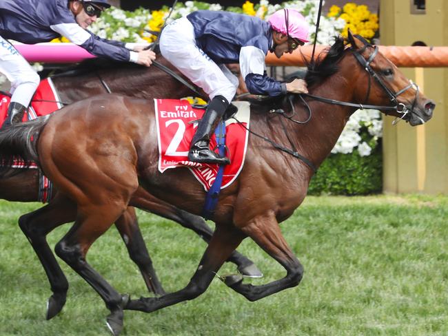 Rekindling with Jockey Corey Brown wins the 2017 Emirates Melbourne Cup ahead of Johannes Vermeer with jockey Ben Melham at Flemington racecourse in Melbourne, Tuesday, November 7, 2017. (AAP Image/David Crosling) NO ARCHIVING