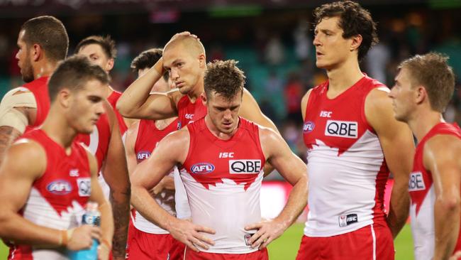 SYDNEY, AUSTRALIA — APRIL 22: Swans players look dejected after the round five AFL match between the Sydney Swans and the Greater Western Sydney Giants at Sydney Cricket Ground on April 22, 2017 in Sydney, Australia. (Photo by Matt King/AFL Media/Getty Images)