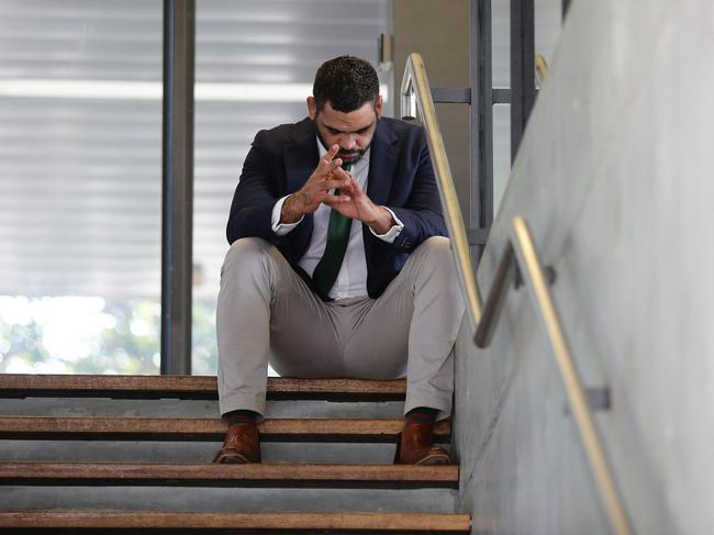 South Sydney NRL player Greg Inglis sits on a stairwell in the moments before announcing his retirement during a press conference at Redfern Oval, Sydney. Picture: Brett Costello