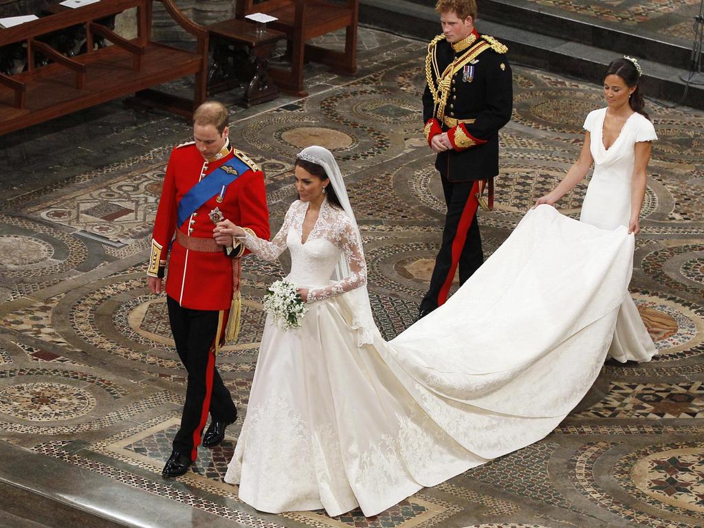 Prince William takes the hand of his bride Catherine Middleton followed by Prince Harry and Pippa Middleton as they walk down the aisle inside Westminster Abbey on April 29, 2011. Picture: Getty