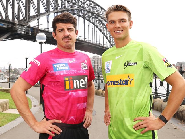 SYDNEY, AUSTRALIA - NOVEMBER 29:   Moises Henriques of the Sydney Sixers and Chris Green of the Sydney Thunder pose during the 2021/22 BBL Season Launch at Hickson Road Reserve on November 29, 2021 in Sydney, Australia. (Photo by Mark Kolbe/Getty Images)