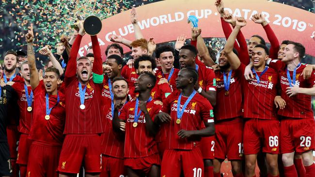 Liverpool players celebrate the club’s first-ever Club Word Cup trophy. Picture: Getty Images