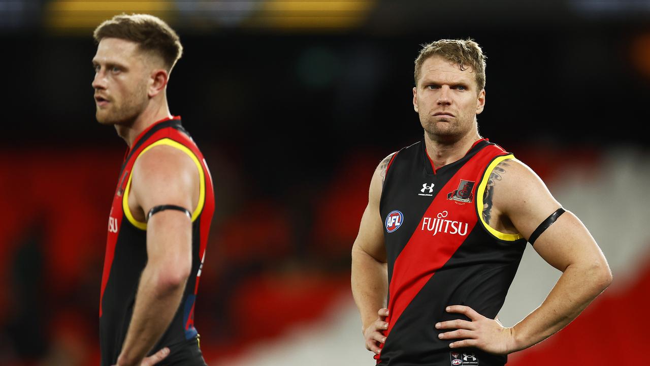 MELBOURNE, AUSTRALIA - AUGUST 14: Jake Stringer of the Bombers (R) and Jayden Laverde of the Bombers react on the final siren during the round 22 AFL match between the Essendon Bombers and the Port Adelaide Power at Marvel Stadium on August 14, 2022 in Melbourne, Australia. (Photo by Daniel Pockett/Getty Images)