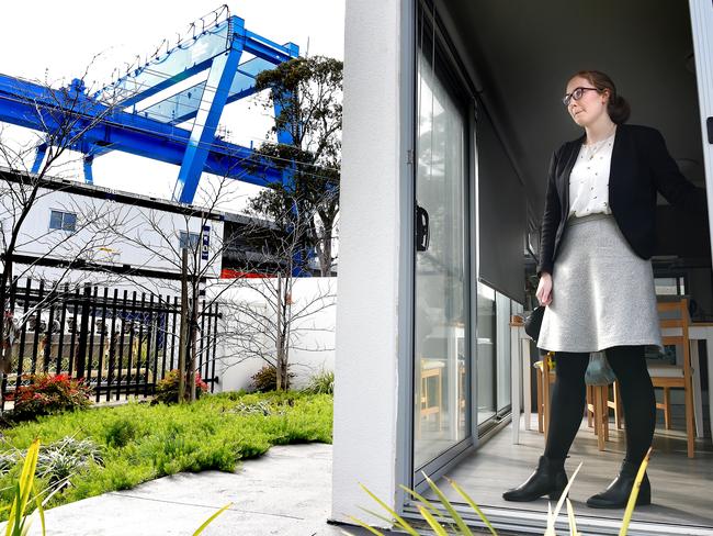 Trixie Gardiner inside her home, with the 60 metre-long wheeled carrier overlooking her backyard. Picture: Nicole Garmston