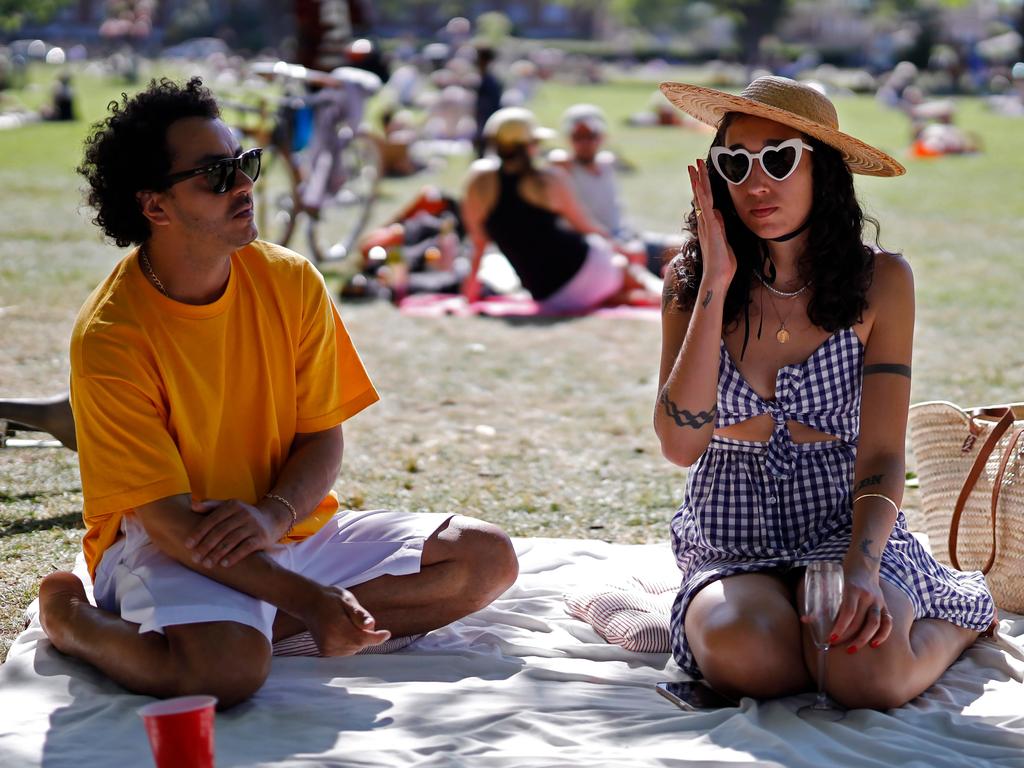 A group of MPs was also critical of the confusion around asymptomatic people – those that might have the disease but don’t show any symptoms. Pictured, a couple picnic in London Fields. Picture: Tolga Akmen / AFP