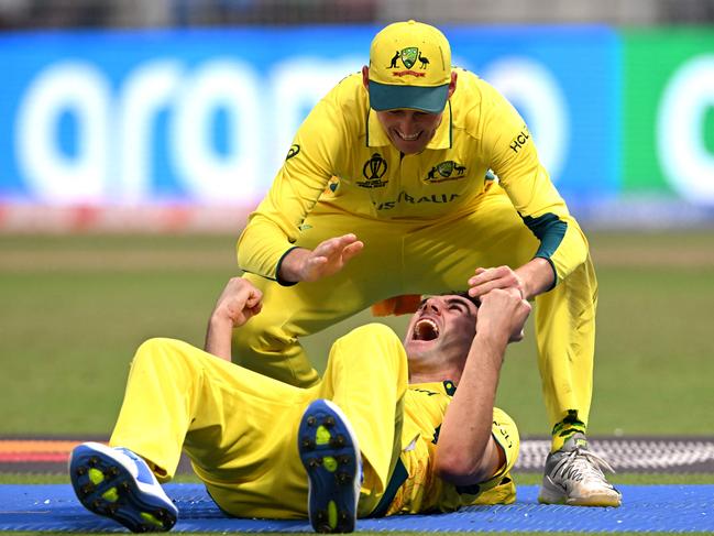 Pat Cummins is congratulated after a miraclous catch to remove Quinton de Kock. Picture: Dibyangshu Sarkar