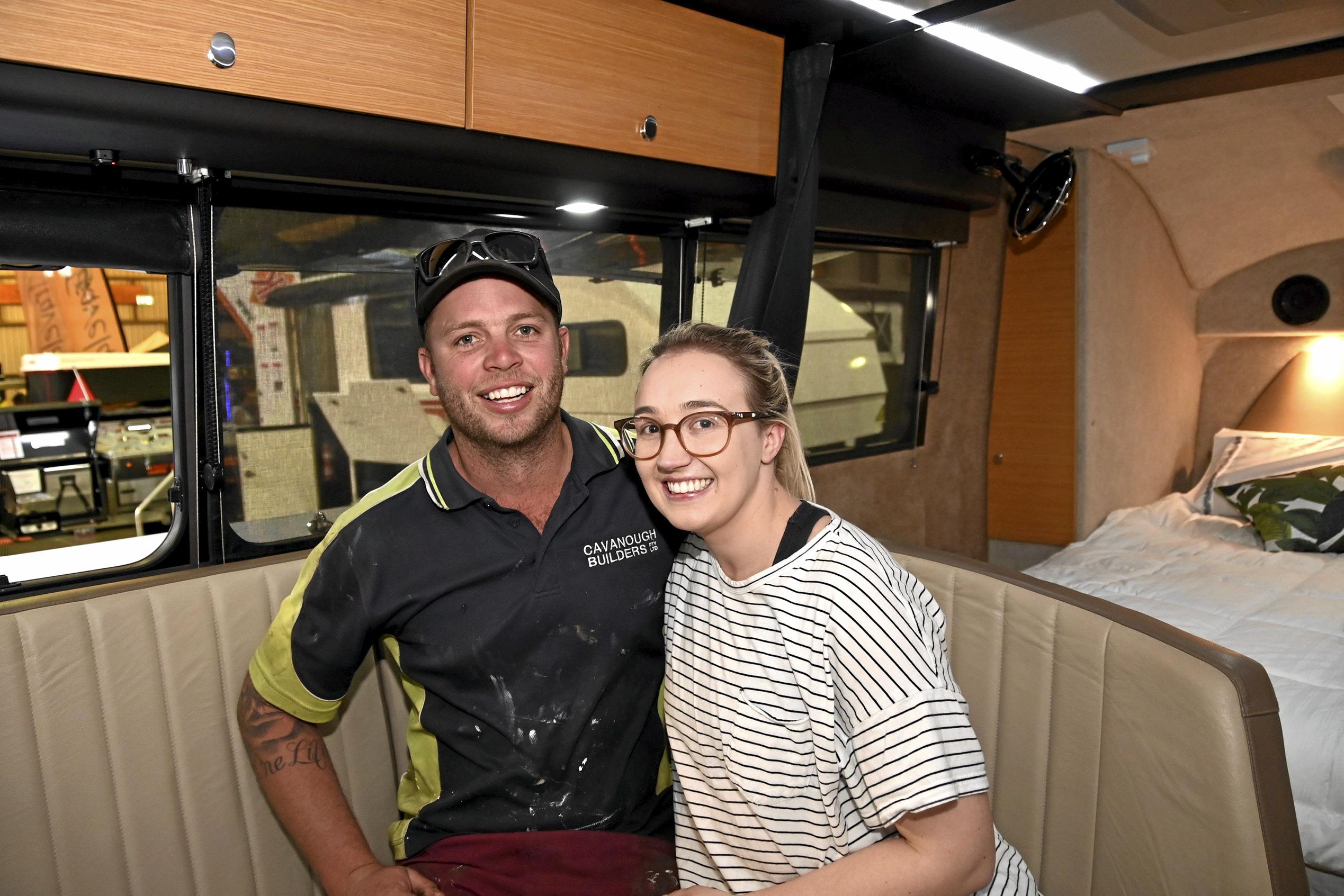 Blake and Kate McAuliffe try the dining experience inside a caravan at the Queensland Outdoor Adventure and Motoring Expo.  August 2019. Picture: Bev Lacey