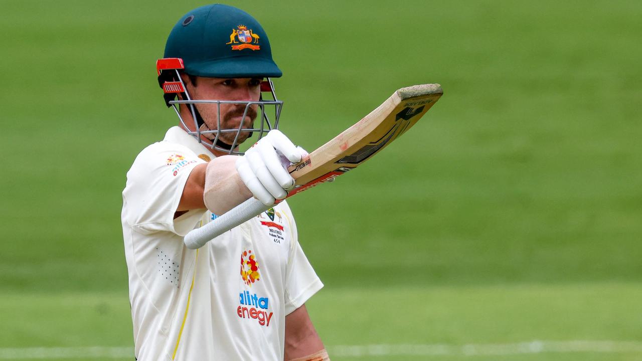 Australia's Travis Head celebrates 150 runs during day three of the first Ashes cricket Test match between England and Australia at the Gabba in Brisbane on December 10, 2021. (Photo by Patrick HAMILTON / AFP) / -- IMAGE RESTRICTED TO EDITORIAL USE - STRICTLY NO COMMERCIAL USE --