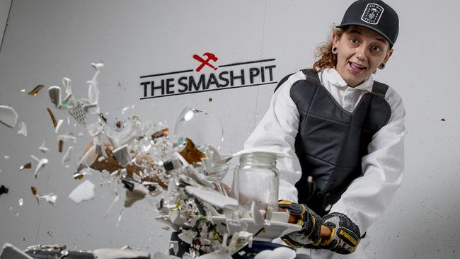 April Hard  smashing up plates and cups at Smash Pit in Southport. Picture: Jerad Williams