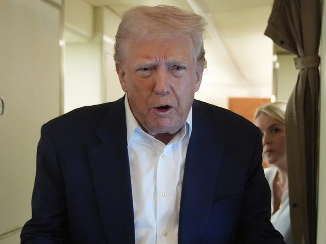 President Donald Trump talks with reporters on Air Force One as he heads back to Washington, Sunday, May 4, 2025, from West Palm Beach, Fla. (AP Photo/Manuel Balce Ceneta)