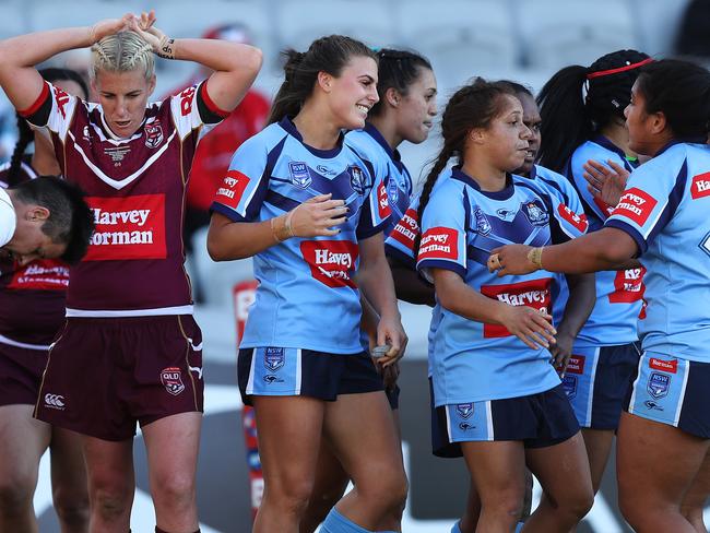 NSW's Jessica Sergis after scoring her third try. Pic: Brett Costello