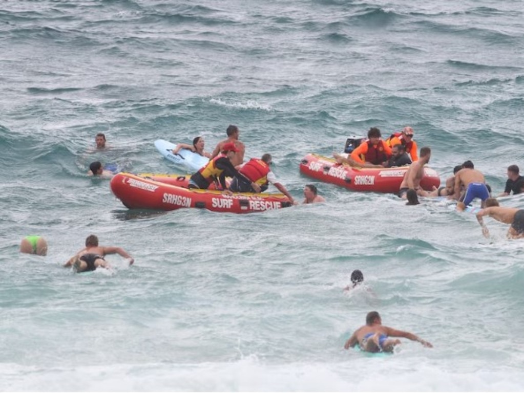 Ironman and Ironwoman athletes dived into rescue a huge group people at Maroubra beach. Picture: Nine