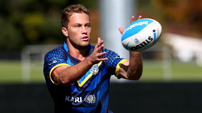 Matt Moylan takes a pass during training.