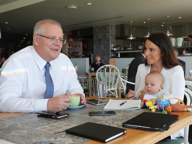 Sharri Markson interviews Scott Morrison during the federal election campaign while holding her baby Raphi. Picture: Adam Taylor