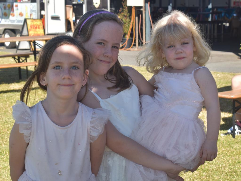 Azaria, Sienna and Sophia McIver at the Rockhampton Jockey Club's Pink Ribbon Stradbroke Charity Race Day at Callaghan Park on June 15, 2024.