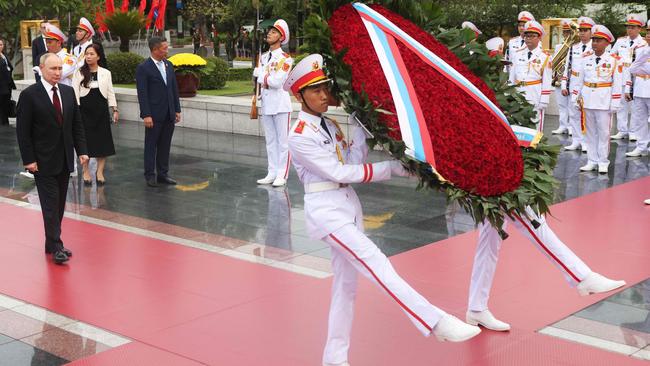 Russia's President Vladimir Putin (L) attends a wreath-laying ceremony at the Memorial to Fallen Heroes in Hanoi on June 20, 2024. Picture: AFP