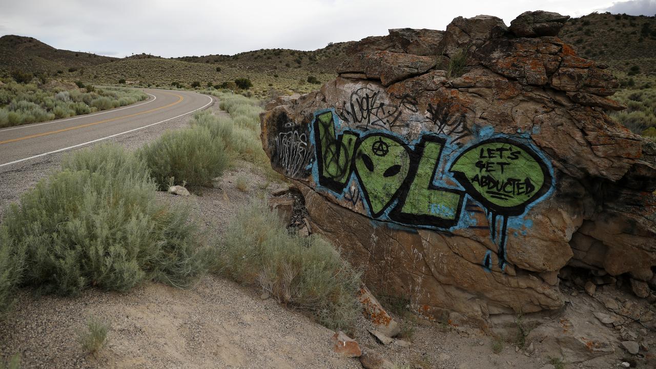 Alien-themed graffiti adorns a rock along the Extraterrestrial Highway near Rachel, Nevada, the closest town to Area 51. Picture: AP/John Locher.