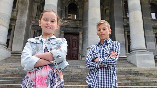 Premier for the day? Lori Morath, 10, would open up the border to Victoria while friend Oliver Straga, also 10, would ban homework. Picture: Brenton Edwards