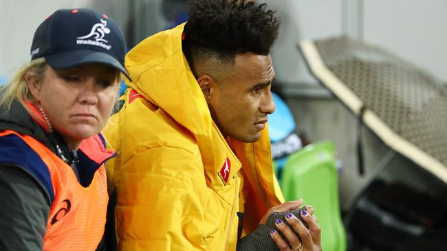 Will Genia of the Wallabies leaves the field injured at AAMI Park.