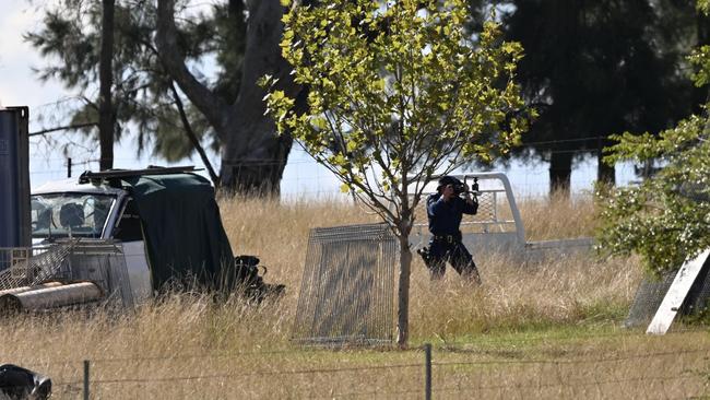 Forensic police at the crime scene after the bodies of Chris Gillespie and Kelly Williams were found in a shipping container outside Gulgong. Picture: NCA NewsWire/Colin Boyd