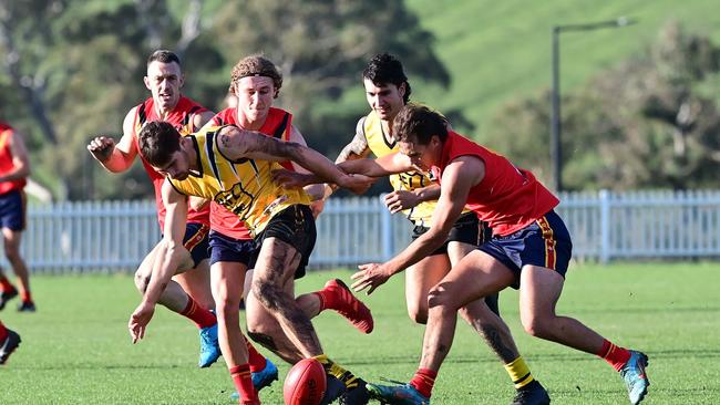 River Murray FL players clash with the Hills FL during interleague last season. Country leagues are awaiting directives regarding concussion protocols for this coming season. Picture: Mark Liebich