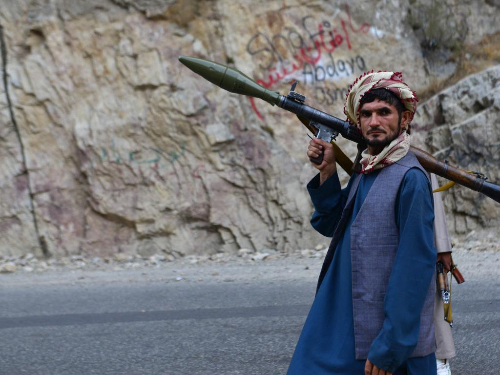 An Afghan resistance movement and anti-Taliban uprising forces personnel patrols along a road in Rah-e Tang of Panjshir province. Picture: AFP