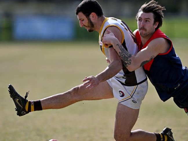 NFL: Diamond Creek’s Robby Noble catches Daniel Caruso of Thomastown. Picture: Andy Brownbill