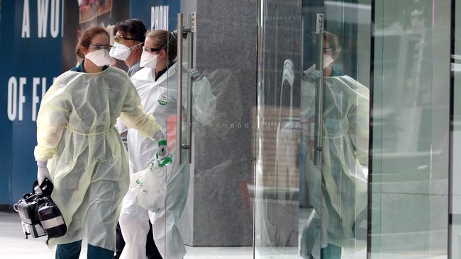 Paramedics outside the Oracle building in Broadbeach on Tuesday. Picture: Mega Agency.