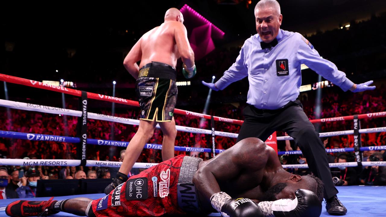 Tyson Fury (top) knocks out Deontay Wilder in the 11th round. Photo by Al Bello/Getty Images.