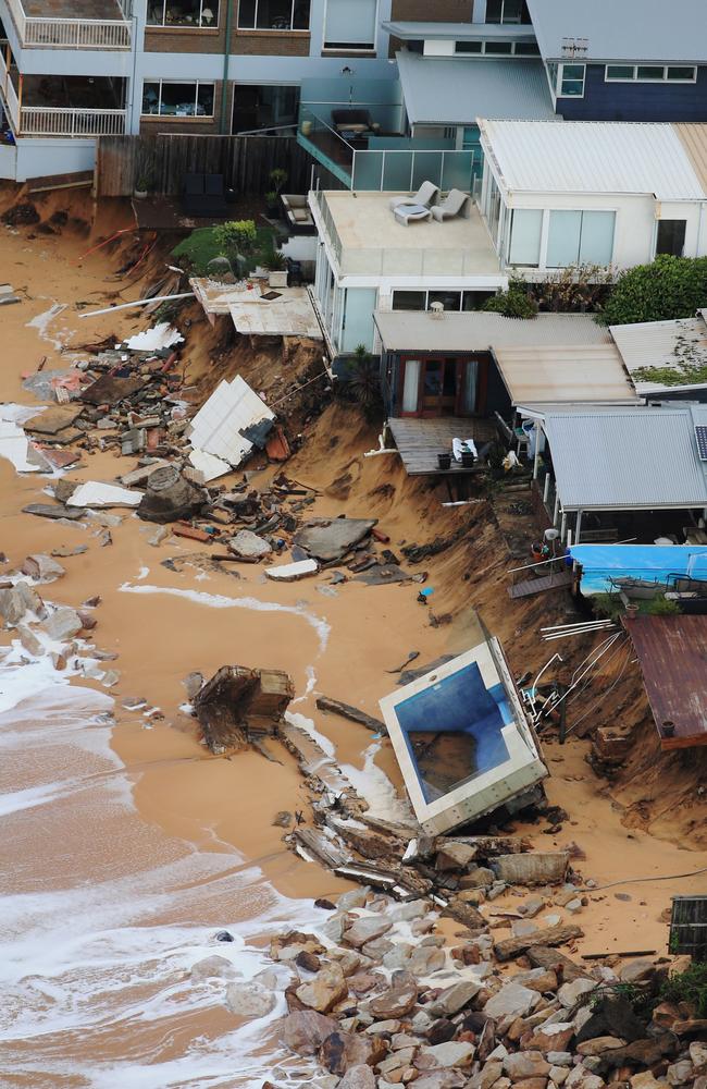 An aerial photograph taken yesterday shows how the swimming pool was dragged from a beachfront back garden. Picture: Toby Zerna