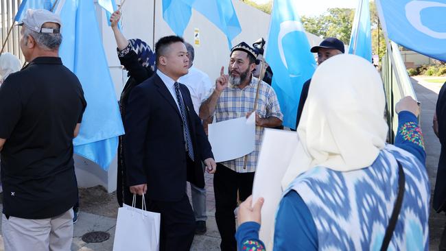 Protesters chant at guests outside the SA Chinese consulate in Adelaide before its opening ceremony. Picture: NCA NewsWire / David Mariuz